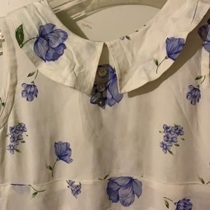 A white dress with blue ish purple flowers, was a Sunday dress and Easter dress.